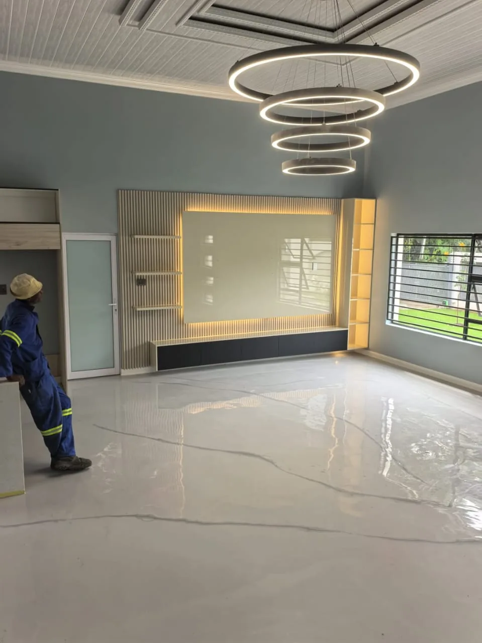 Completed illuminated TV feature wall and luxury interior